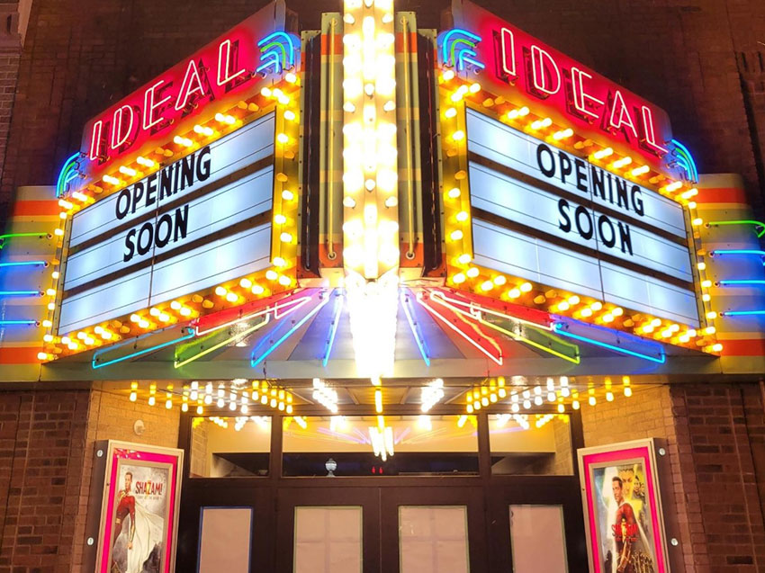 brightly lit marquee of the Ideal Theatre
